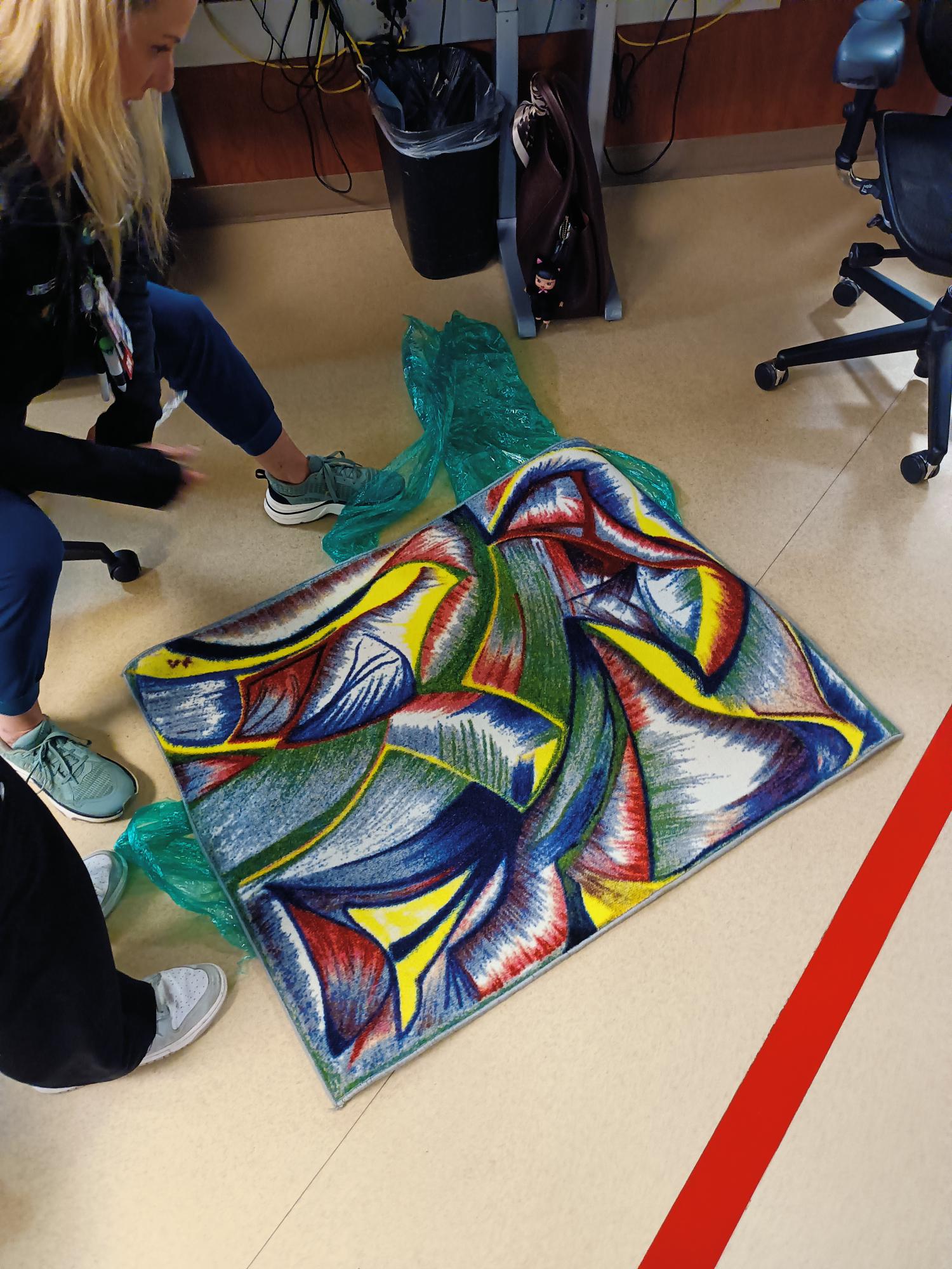 Colorful abstract textile artwork on floor
